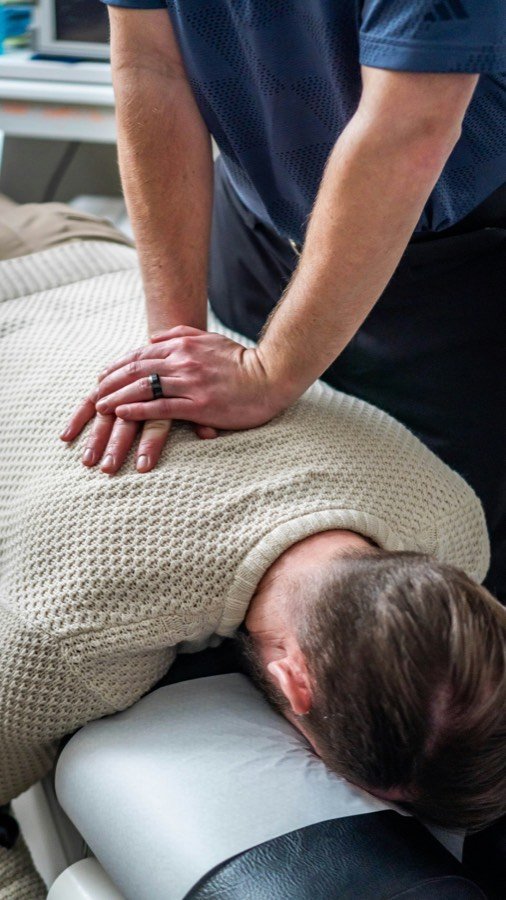 Physiotherapist treating a patient's neck and shoulder